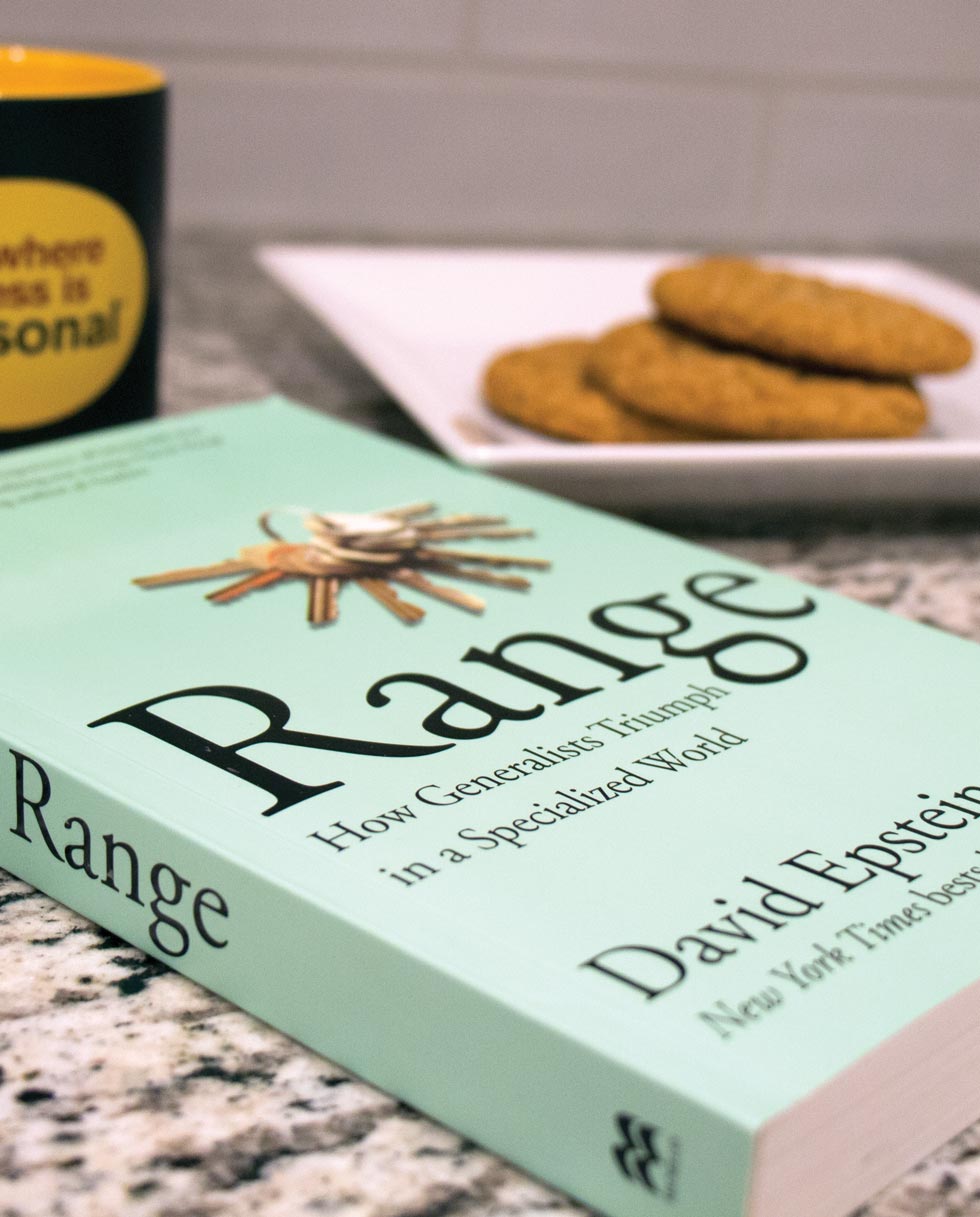 Range book on counter with coffee mug and cookies