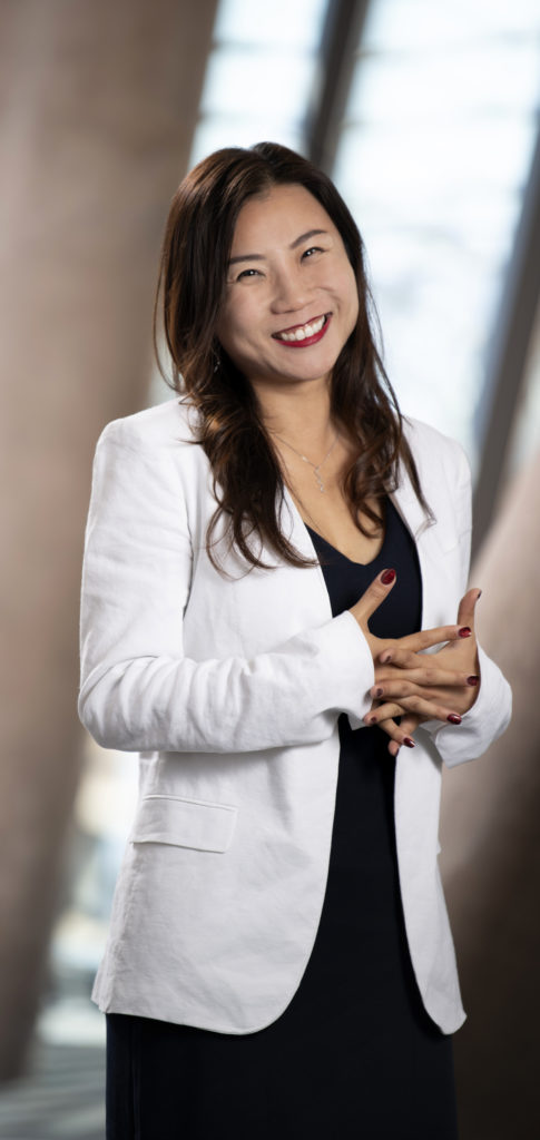Lelle Wang, smiling in a white blazer