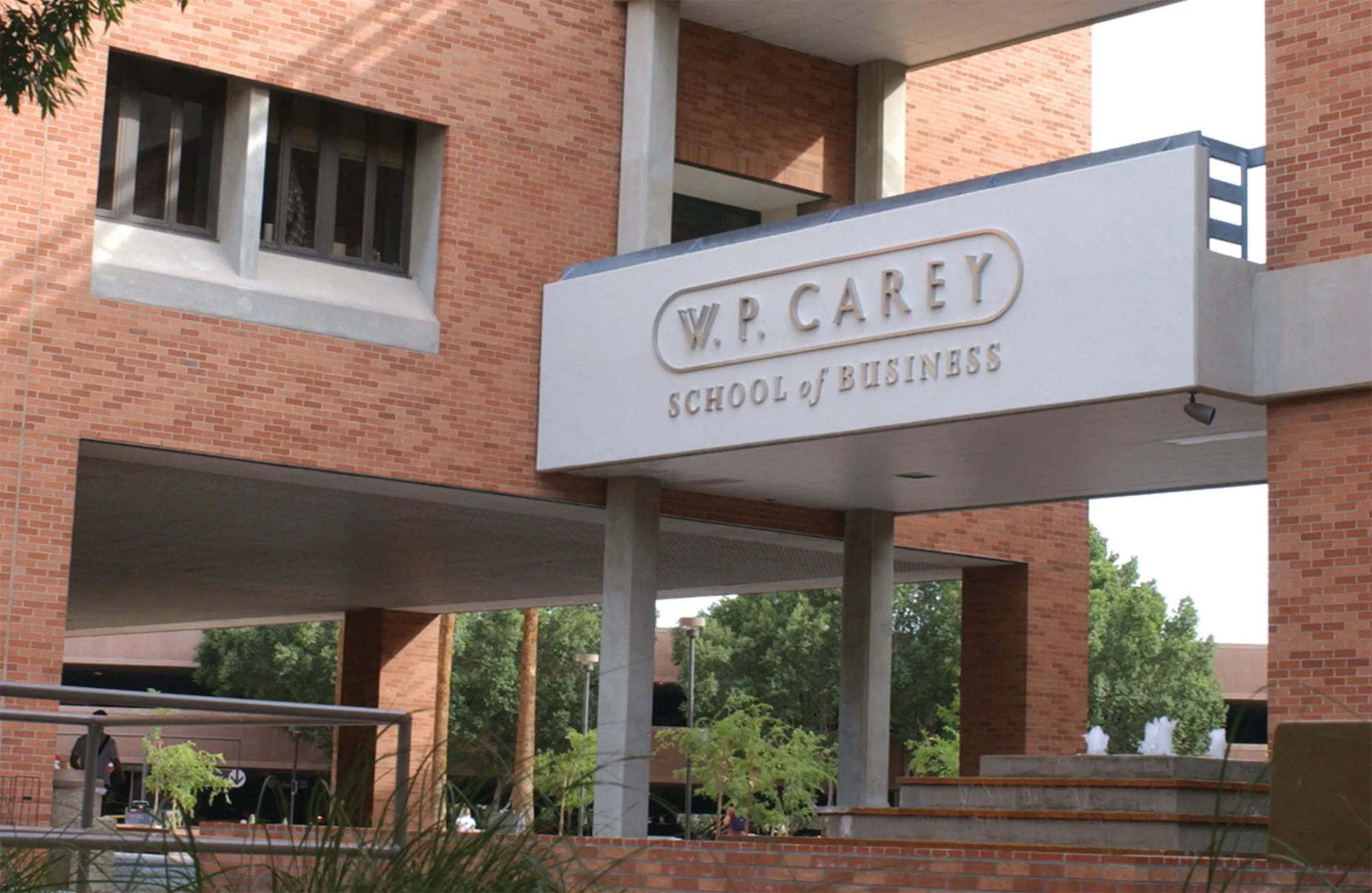 Campus building balcony with W.P. Carey School of Business sign