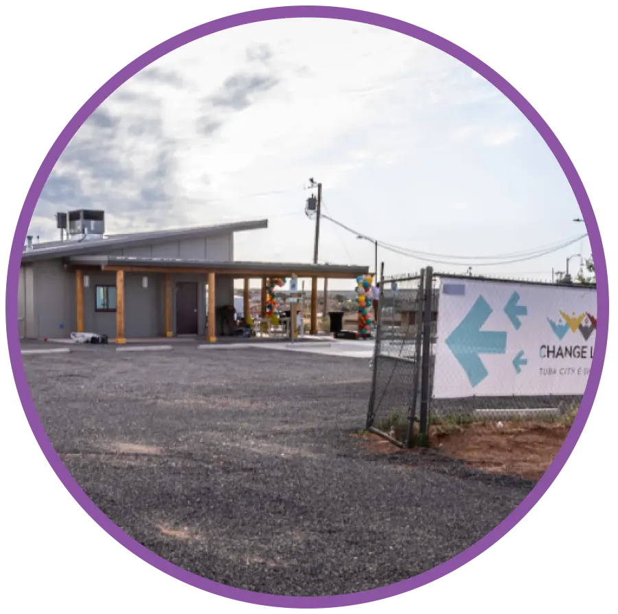 Dark purple color outer circular icon displaying the outside exterior building facility premises of the Change Labs entrepreneur workspace in Tuba City, Arizona