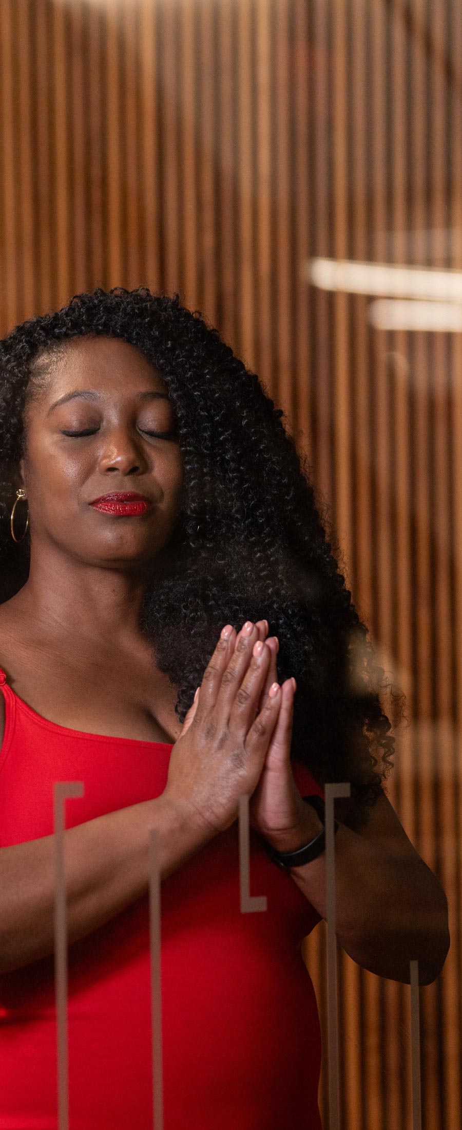 woman meditating with prayer hands