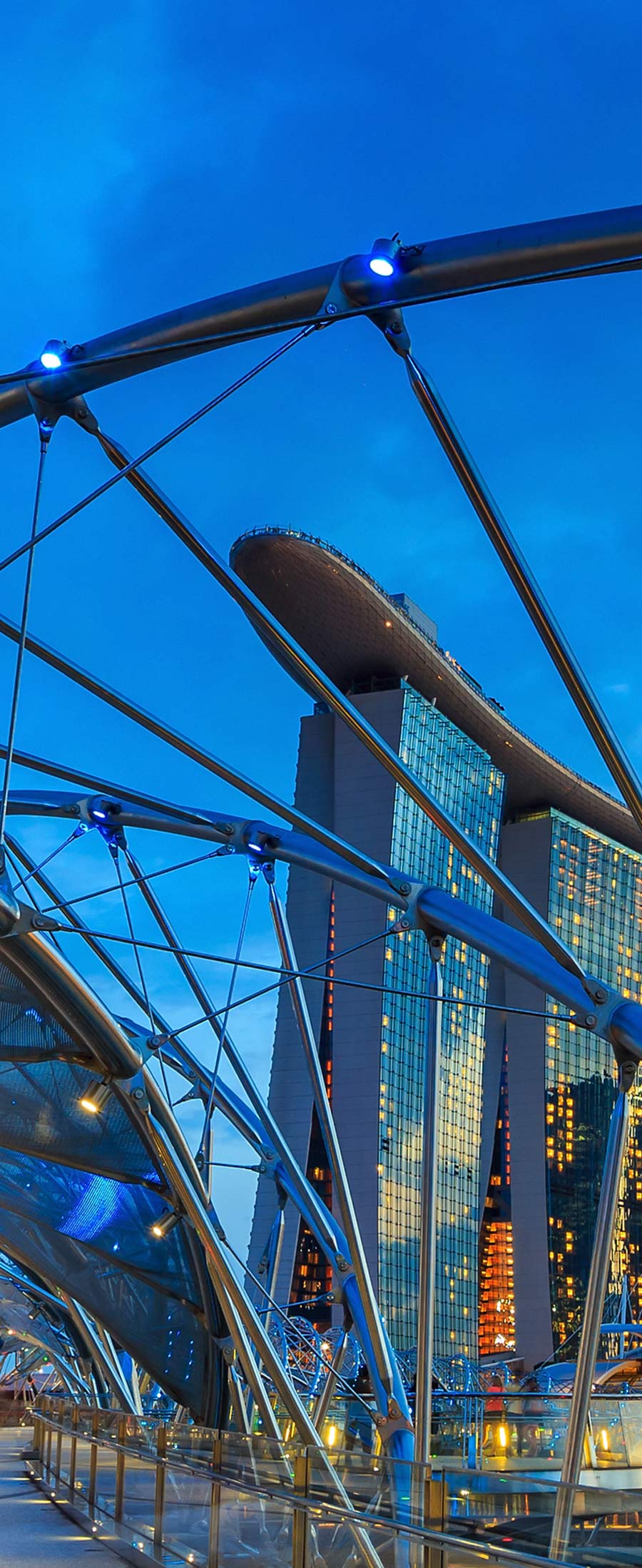 Singapore bridge with skyscraper behind it