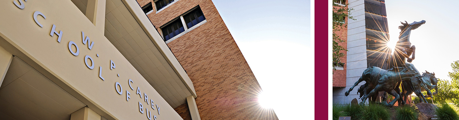 Low-angle view of the W. P. Carey School of Business building alongside a bronze statue of running horses.